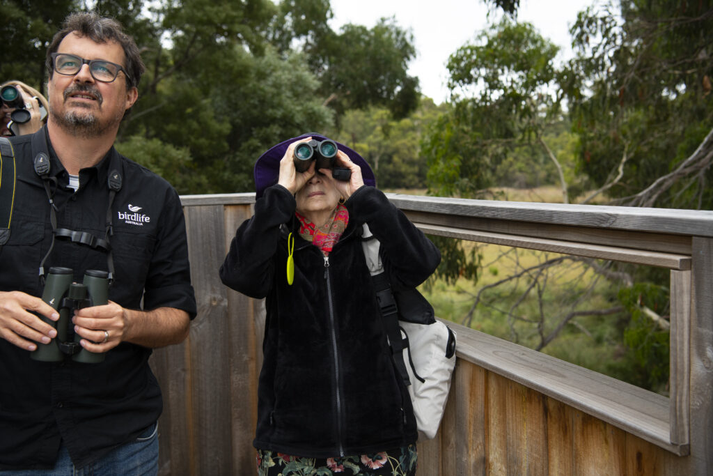 Margaret Atwood and Sean Dooley birdwatching with binoculars