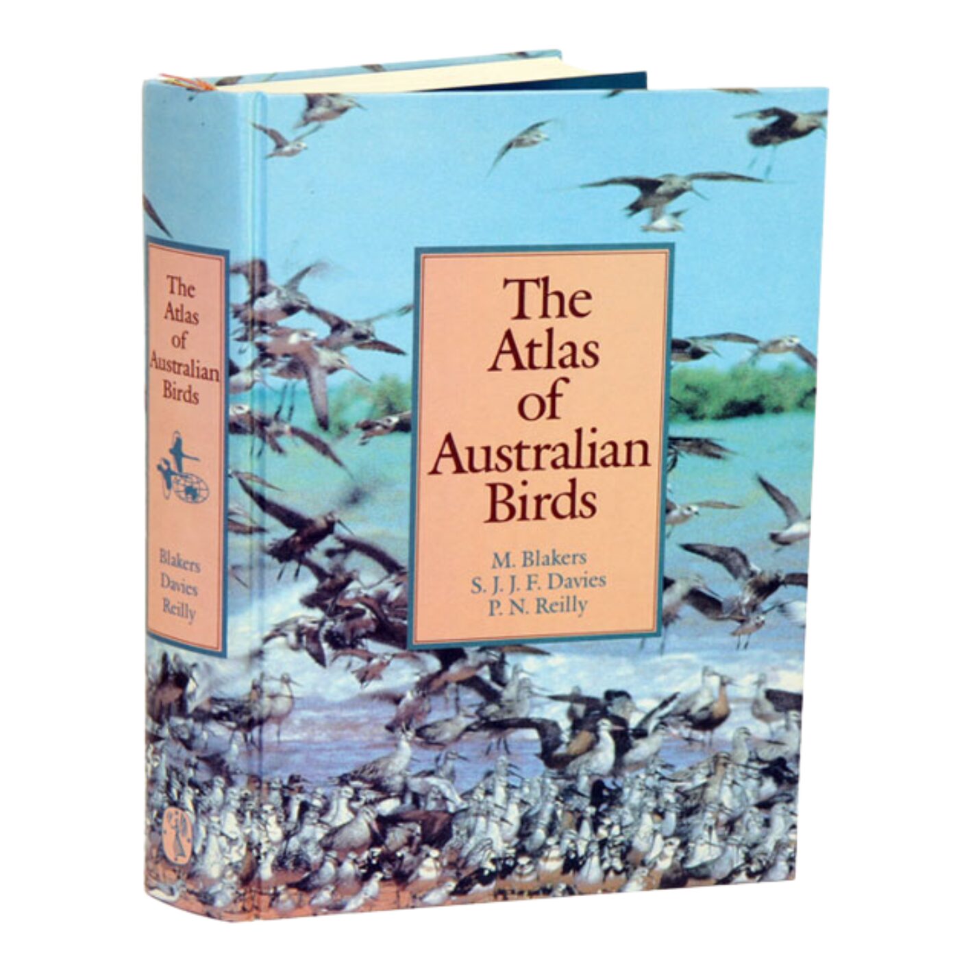 A photograph of first edition of The Atlas of Australian Birds, published in 1984. The cover shows a flock of migratory shorebirds on a shoreline. 